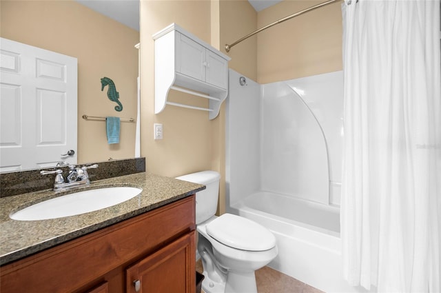 full bathroom with vanity, shower / tub combo, and toilet