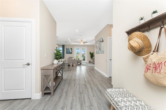 hall with light hardwood / wood-style floors