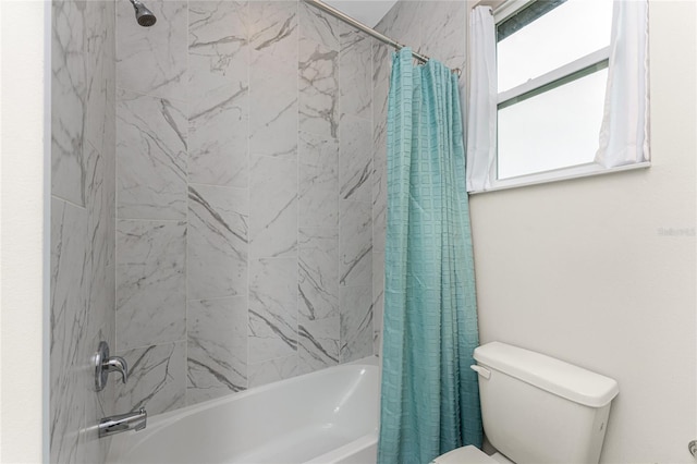 bathroom with shower / tub combo with curtain and toilet