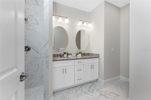 bathroom featuring vanity and a tile shower