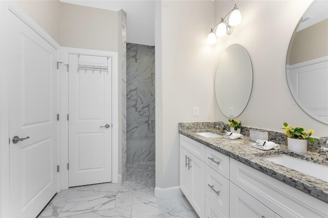 bathroom featuring vanity and a tile shower