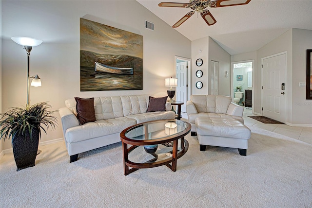 carpeted living room featuring ceiling fan and lofted ceiling