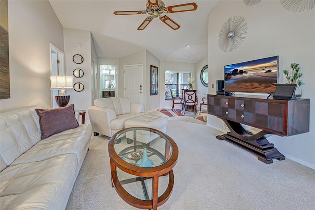 carpeted living room featuring vaulted ceiling and ceiling fan