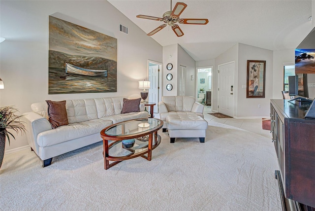 living room featuring lofted ceiling, light carpet, and ceiling fan