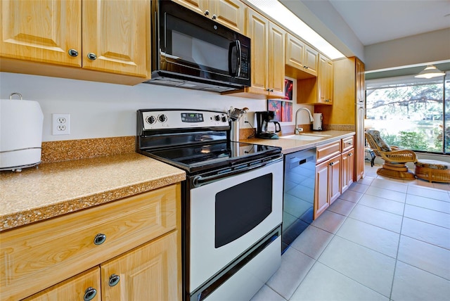 kitchen with sink, light stone counters, light tile patterned floors, dishwasher, and electric stove