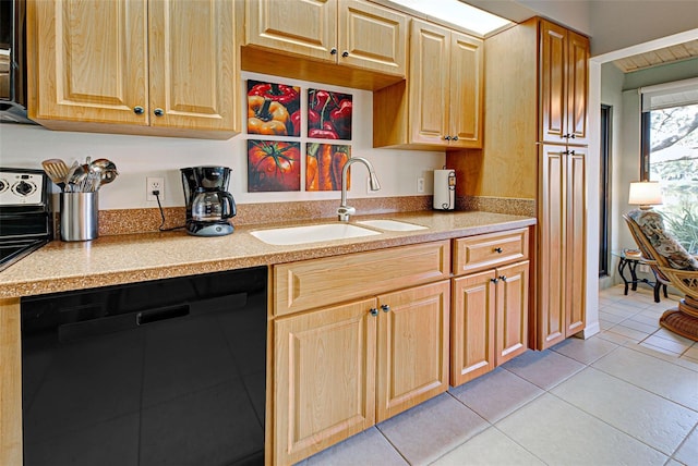 kitchen featuring dishwasher, sink, and light tile patterned flooring