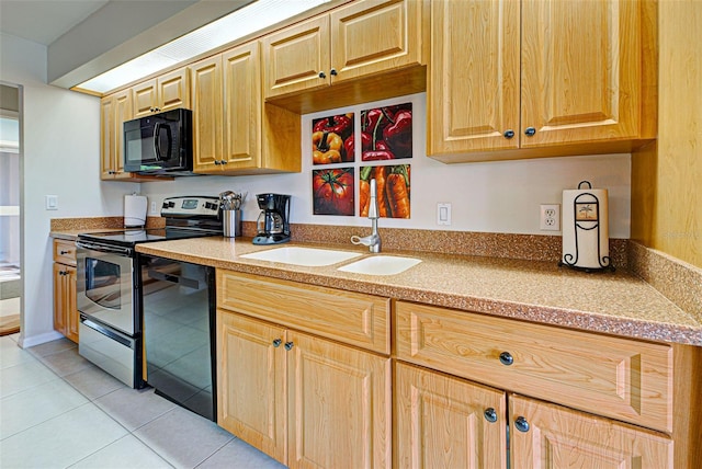 kitchen featuring sink, light tile patterned floors, and black appliances