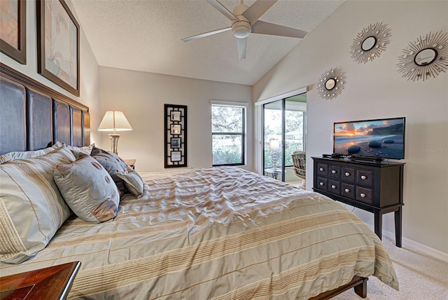 bedroom with ceiling fan, lofted ceiling, carpet, and a textured ceiling