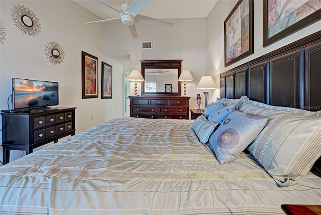 bedroom with high vaulted ceiling