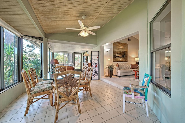 sunroom featuring vaulted ceiling, wooden ceiling, and ceiling fan