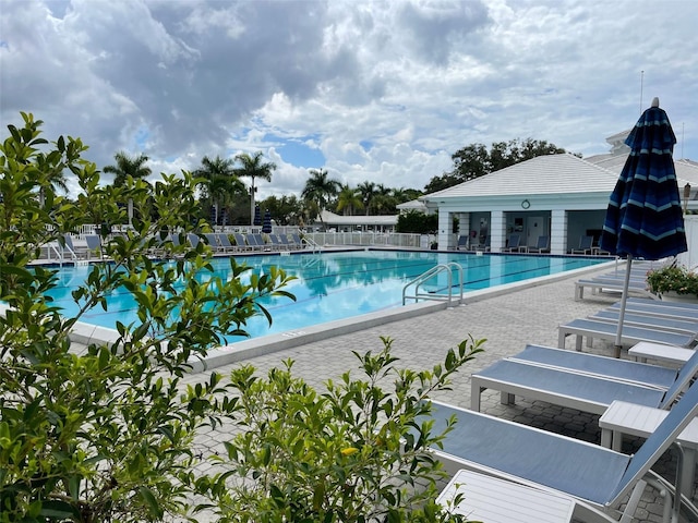 view of swimming pool featuring a patio area