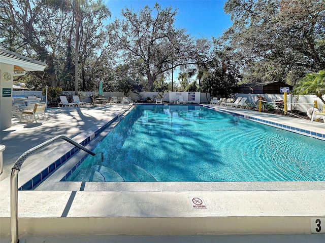 view of swimming pool with a patio area