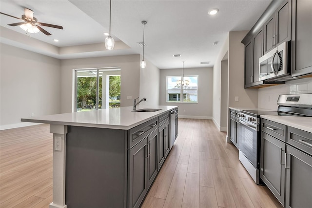 2814 Vogler Ln, North Port, FL 34286 - kitchen with stainless steel appliances, light wood-style flooring, plenty of natural light, light countertops, and recessed lighting