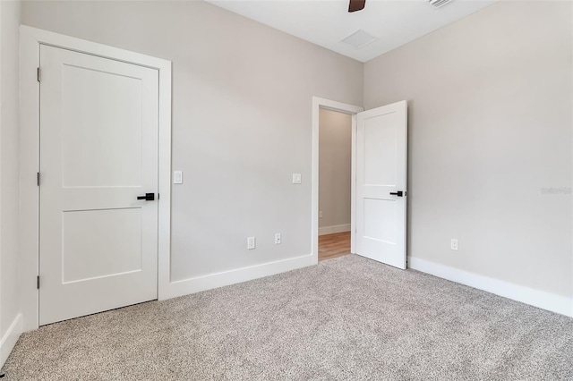 2814 Vogler Ln, North Port, FL 34286 - unfurnished bedroom with carpet and a ceiling fan
