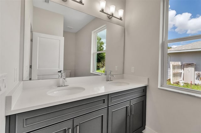2814 Vogler Ln, North Port, FL 34286 - bathroom with double vanity and toilet