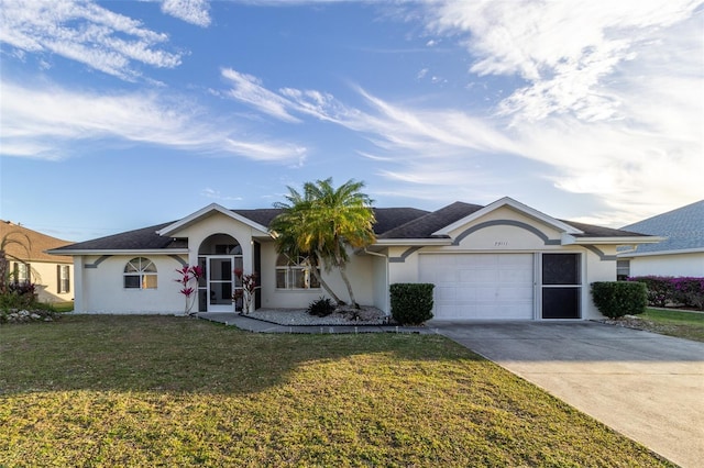 ranch-style home with a garage and a front lawn