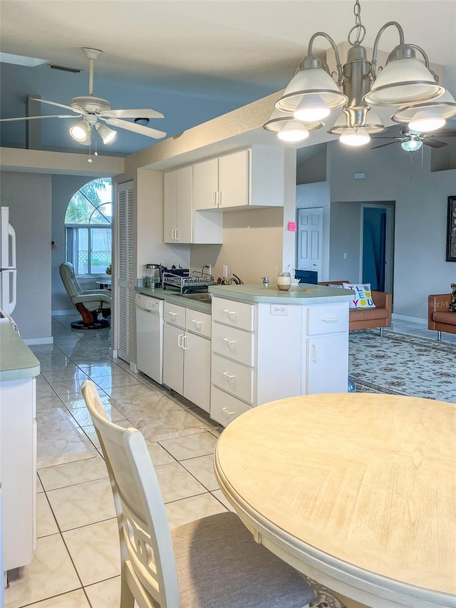 kitchen with white cabinetry, white appliances, vaulted ceiling, and ceiling fan with notable chandelier