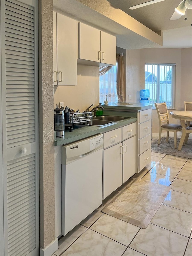 kitchen with ceiling fan, white dishwasher, sink, and white cabinets