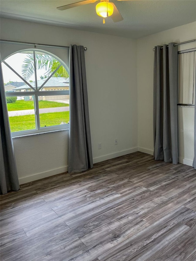 empty room featuring light hardwood / wood-style floors and ceiling fan