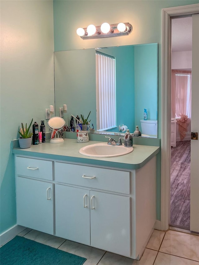 bathroom with tile patterned floors and vanity