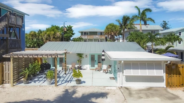 view of front of home with a pergola and a patio