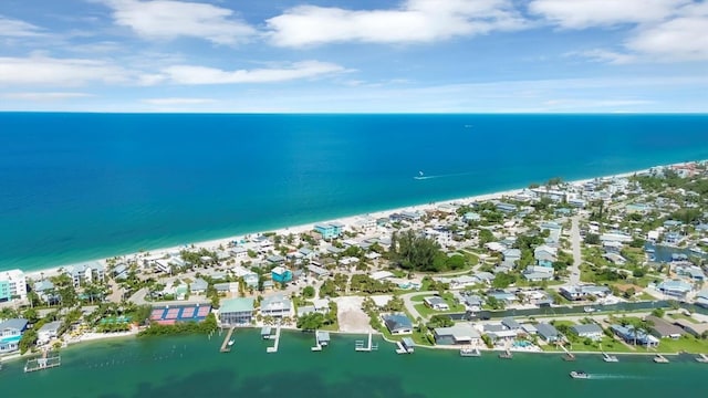 drone / aerial view featuring a water view and a beach view