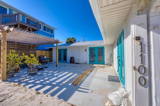 view of patio with a pergola and french doors