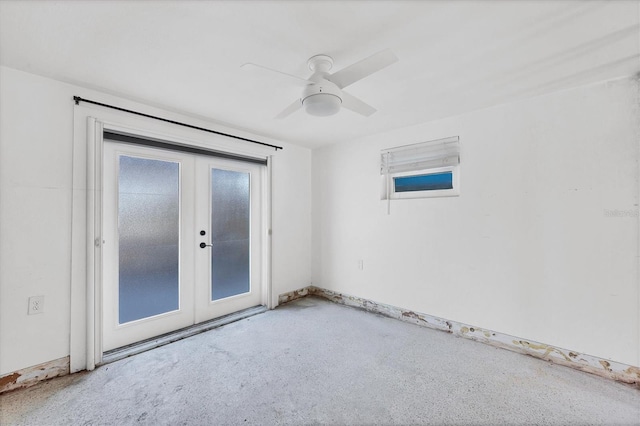 spare room with french doors and ceiling fan