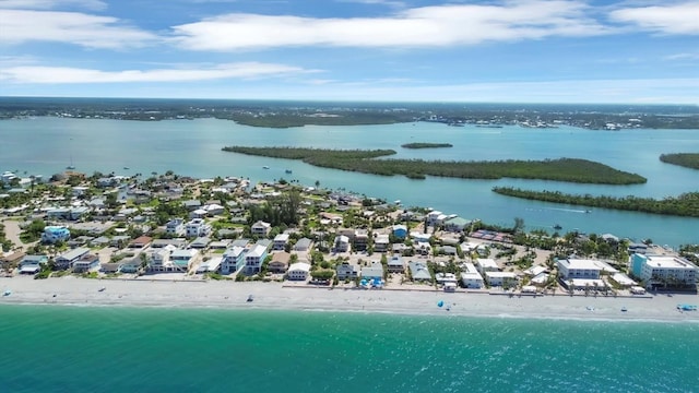 bird's eye view featuring a water view and a view of the beach