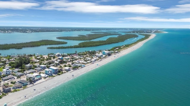 birds eye view of property with a view of the beach and a water view