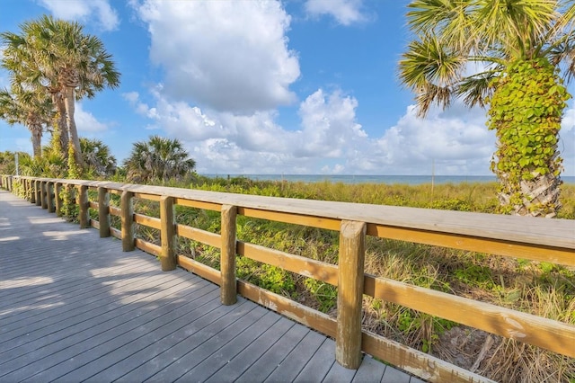 wooden deck with a water view