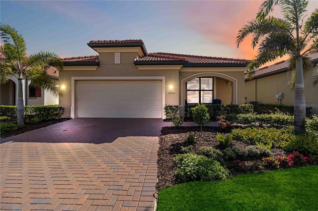 mediterranean / spanish-style house featuring a garage