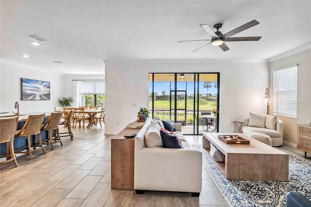 24269 Spartina Dr, Venice, FL 34293 - living room featuring crown molding and ceiling fan
