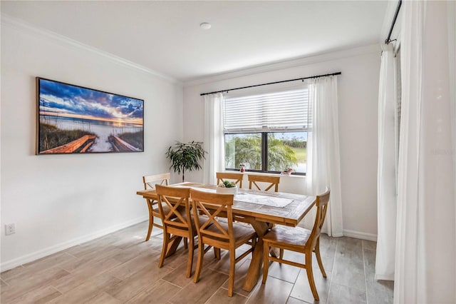 24269 Spartina Dr, Venice, FL 34293 - dining space featuring crown molding and light wood-type flooring
