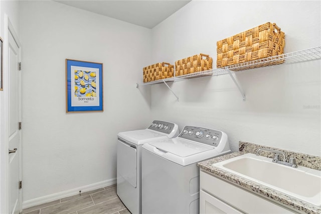 24269 Spartina Dr, Venice, FL 34293 - washroom with sink and independent washer and dryer