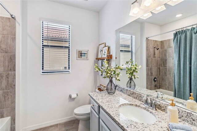24269 Spartina Dr, Venice, FL 34293 - full bathroom with tile patterned flooring, shower / bath combo, vanity, and toilet