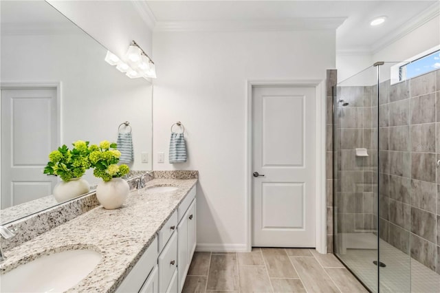 24269 Spartina Dr, Venice, FL 34293 - bathroom featuring a tile shower, vanity, and crown molding