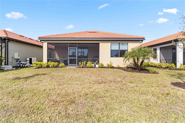 24269 Spartina Dr, Venice, FL 34293 - back of property featuring a sunroom, central AC, and a lawn