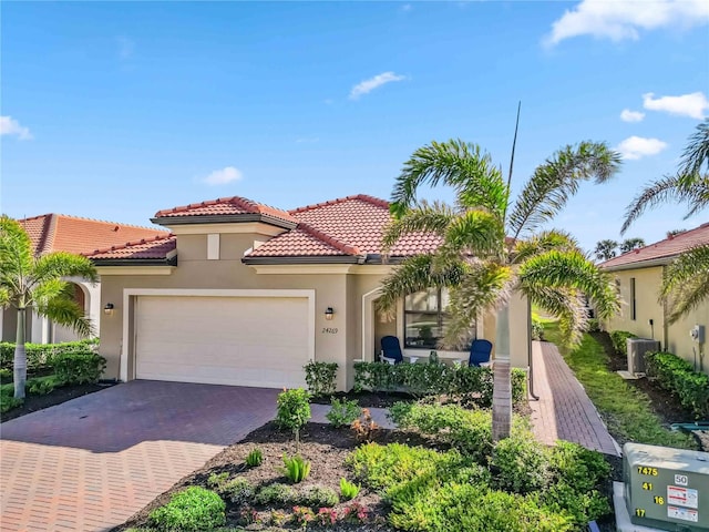 24269 Spartina Dr, Venice, FL 34293 - mediterranean / spanish-style house with a garage