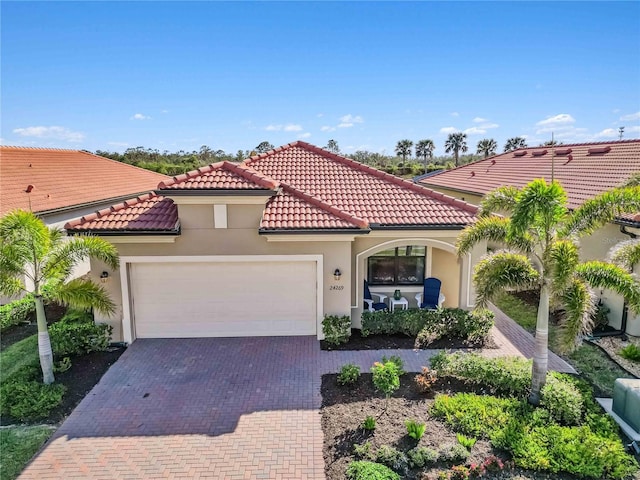 24269 Spartina Dr, Venice, FL 34293 - mediterranean / spanish house with a garage