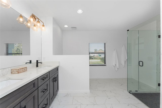 bathroom featuring baseboards, recessed lighting, a stall shower, a sink, and marble finish floor