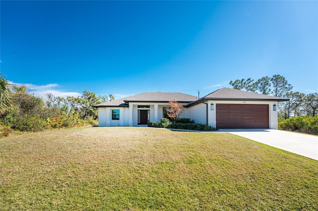 view of front facade with a garage and a front yard