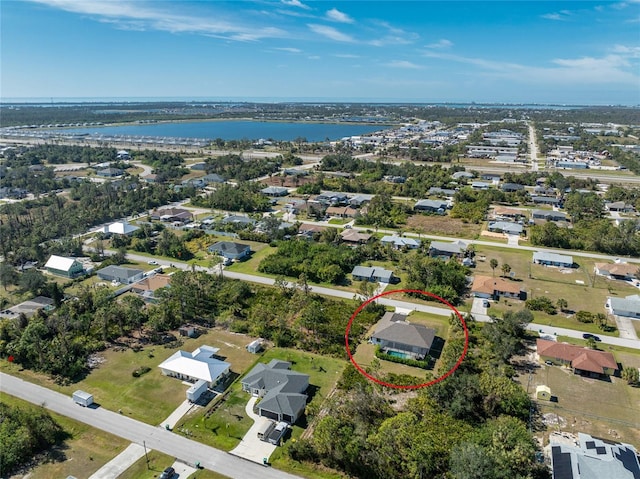 aerial view featuring a water view and a residential view