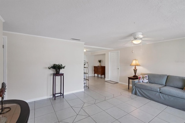 living room featuring ceiling fan, visible vents, crown molding, and light tile patterned floors