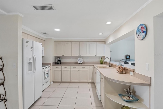 kitchen with white appliances, visible vents, crown molding, a sink, and light tile patterned flooring