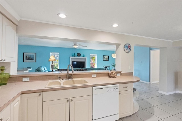 kitchen with ornamental molding, light countertops, dishwasher, and a sink