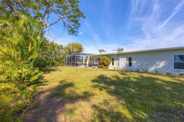 view of yard with a lanai