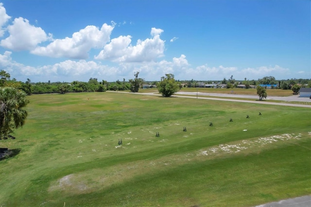 view of property's community featuring a yard