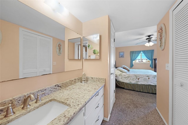 bathroom featuring ceiling fan and vanity