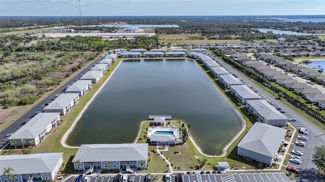 birds eye view of property featuring a residential view and a water view